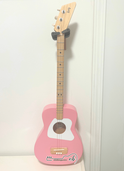 loog pro acoustic hanging on hook