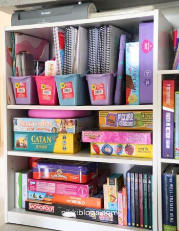 homeschool books organized with magazine holders
