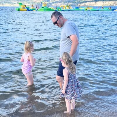 kids road trip tips - dad in lake with kids