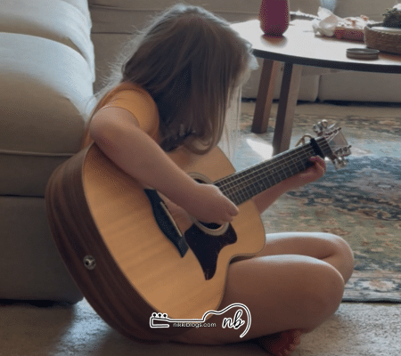 girl playing best beginner guitar for kids taylor gs mini 