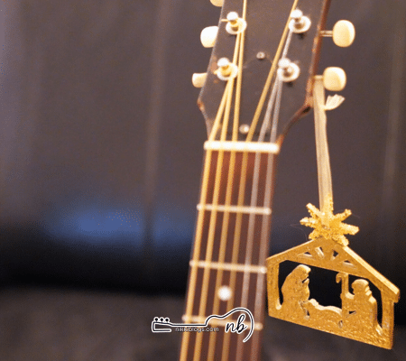 christmas christmas ornament hanging on guitar tuner