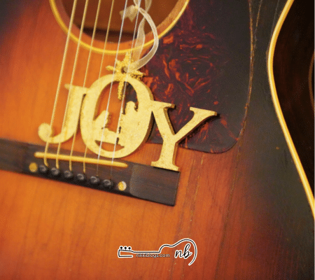christmas christmas ornament under guitar strings