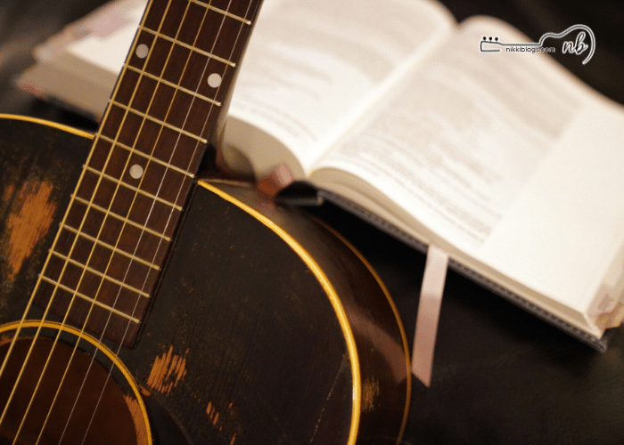 vintage guitar with bible