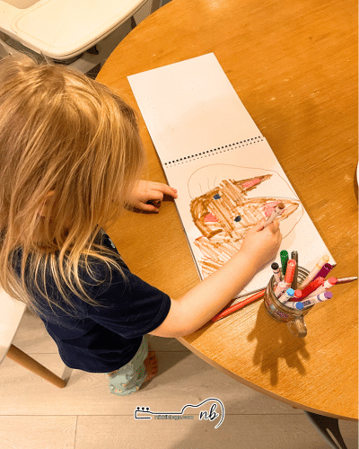 toddler coloring with markers